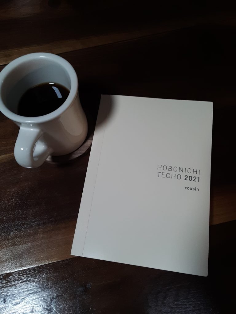 New year planner and hot cup of coffee